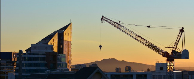 Large crane in an urban area early morning lighting