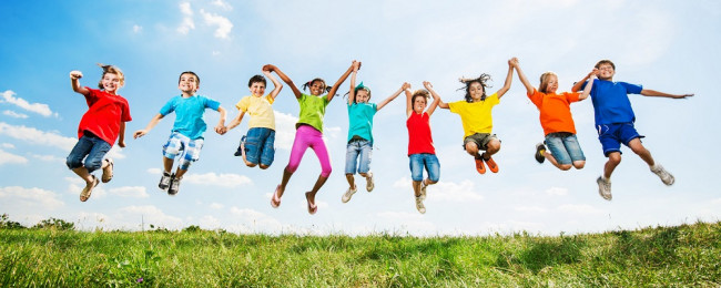 Children jumping in air and holding hands